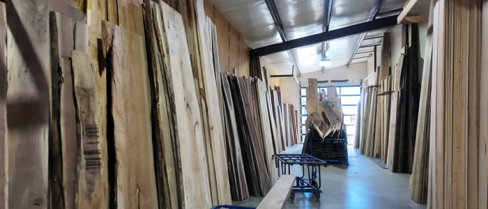 Smooth, stable kiln dried hardwood planks stacked and ready for furniture or construction