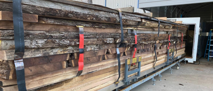 Industrial lumber kiln chamber drying hardwood planks for stable, high-quality lumber