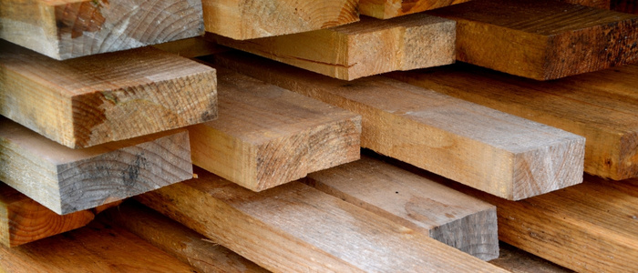 Timber is soaked or impregnated with chemicals that displace water in cell walls.