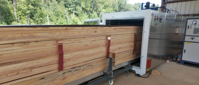 Fresh cut pine boards loaded into Shuowei vacuum kiln