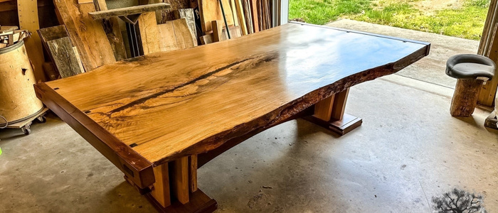Finished live edge walnut table joined with butterfly joints