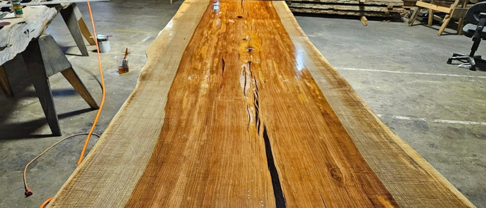 Three common finishes for live edge tables: hardwax oil, polyurethane, epoxy