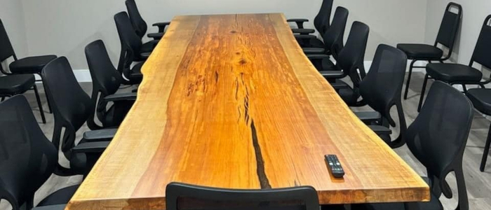 Finished live edge table in a home setting, showcasing natural beauty and grain